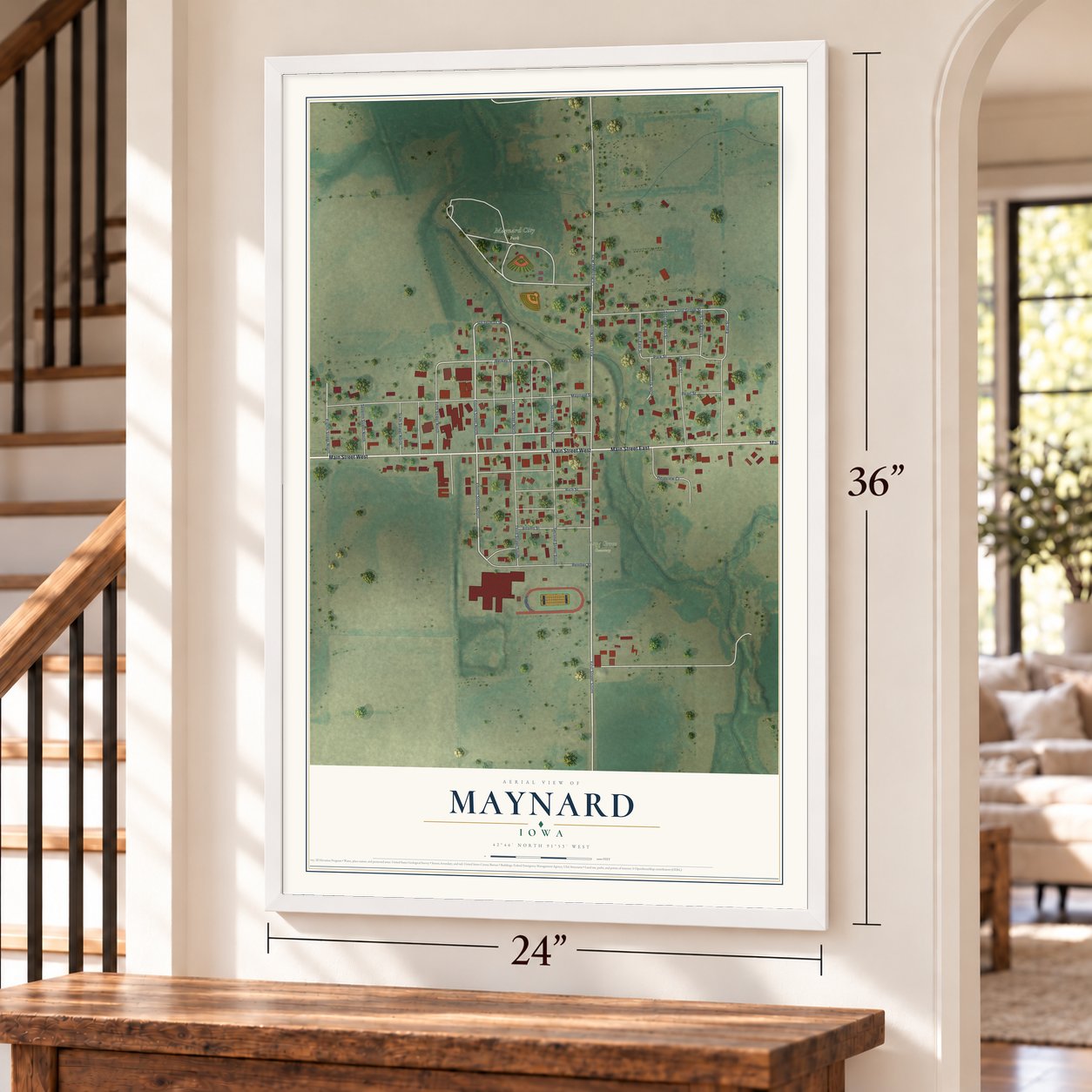 Maynard, Iowa map, 24 x 36 inch print in a white frame by a staircase