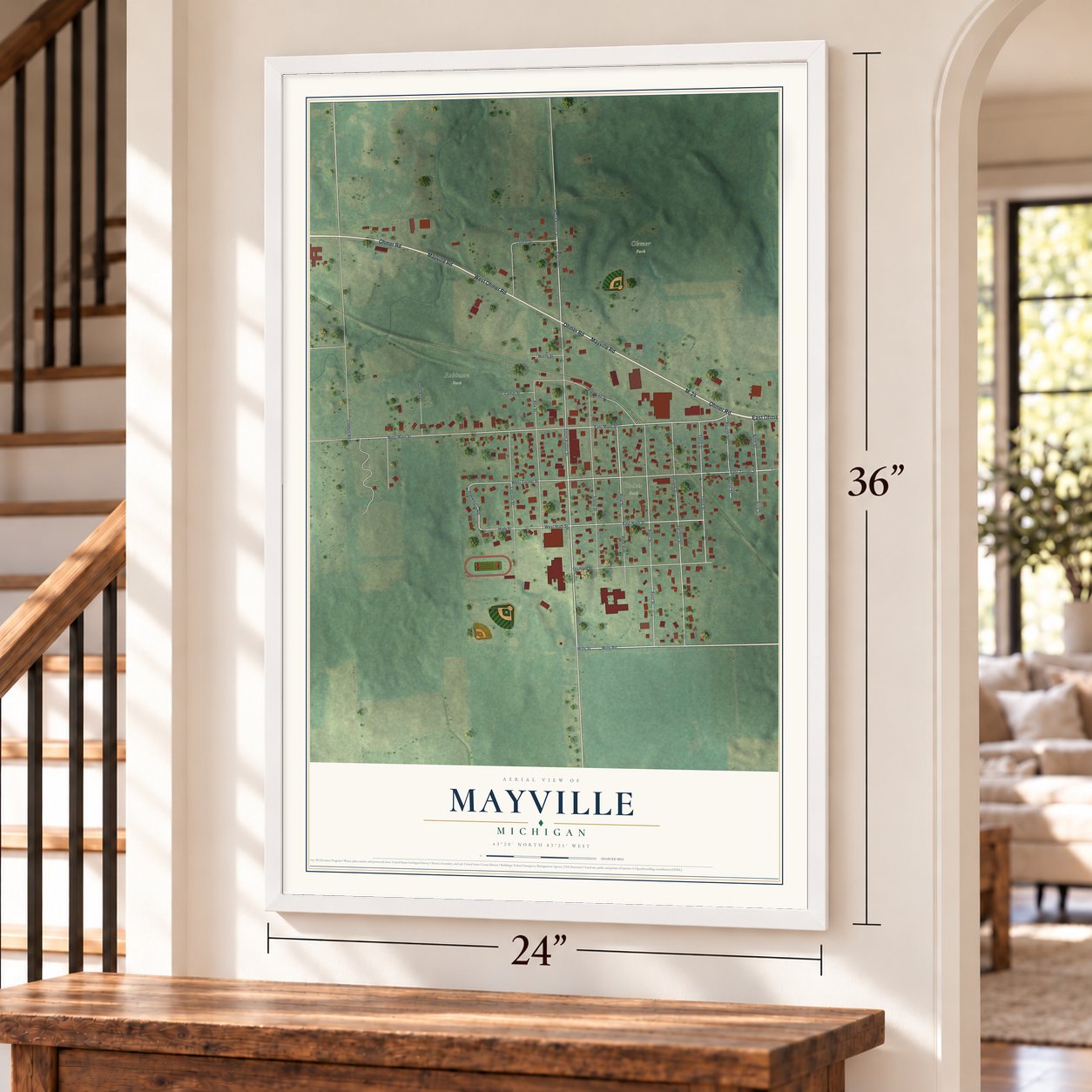 Mayville, Michigan map, 24 x 36 inch print in a white frame by a staircase
