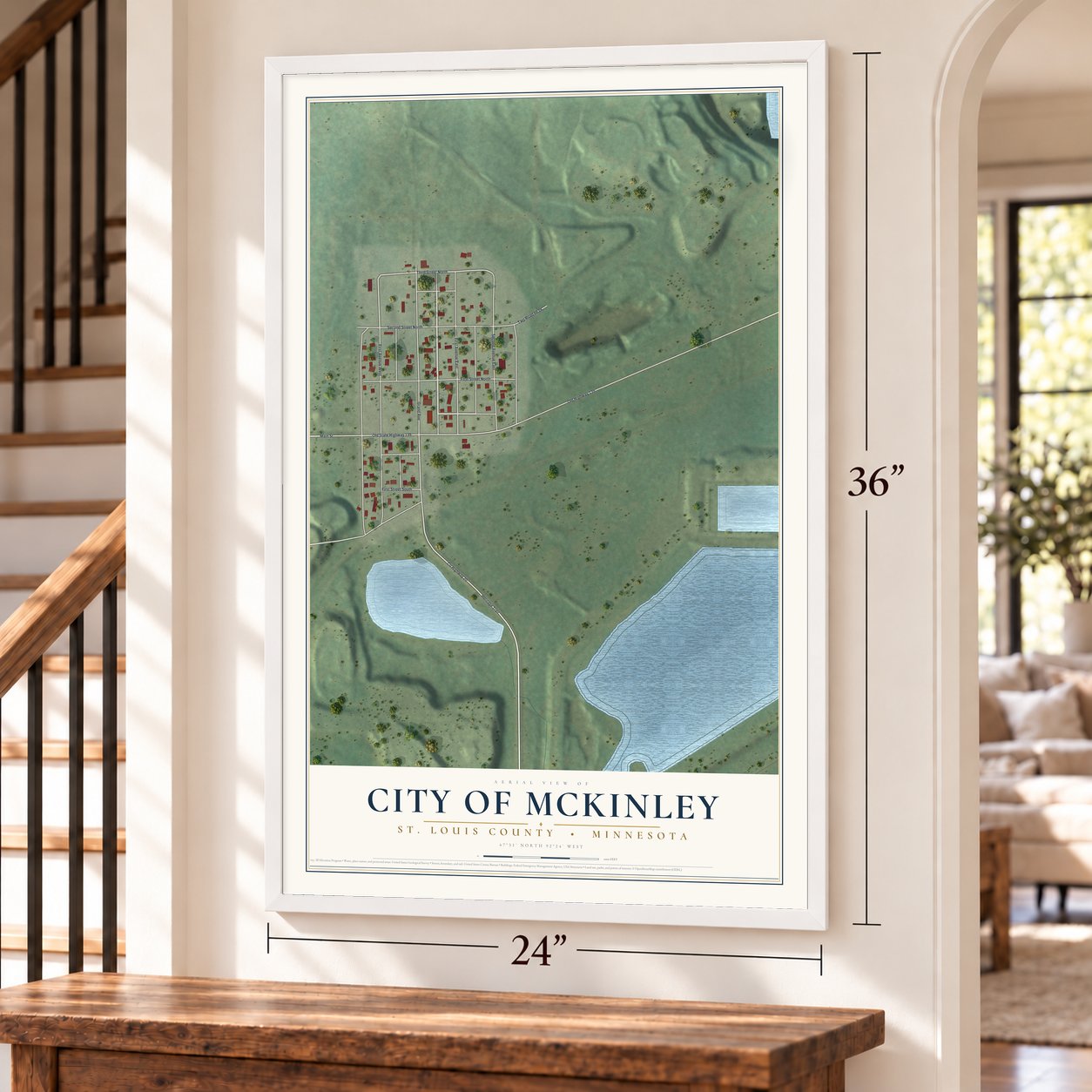 McKinley, Minnesota map, 24 x 36 inch print in a white frame by a staircase