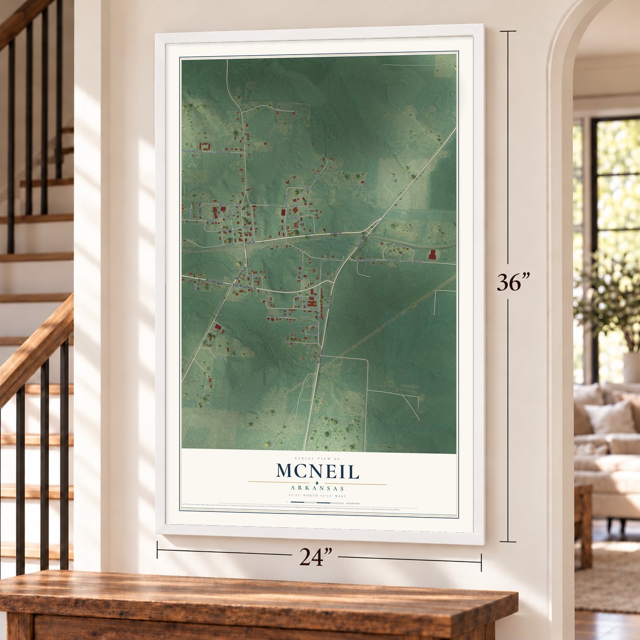McNeil, Arkansas map, 24 x 36 inch print in a white frame by a staircase