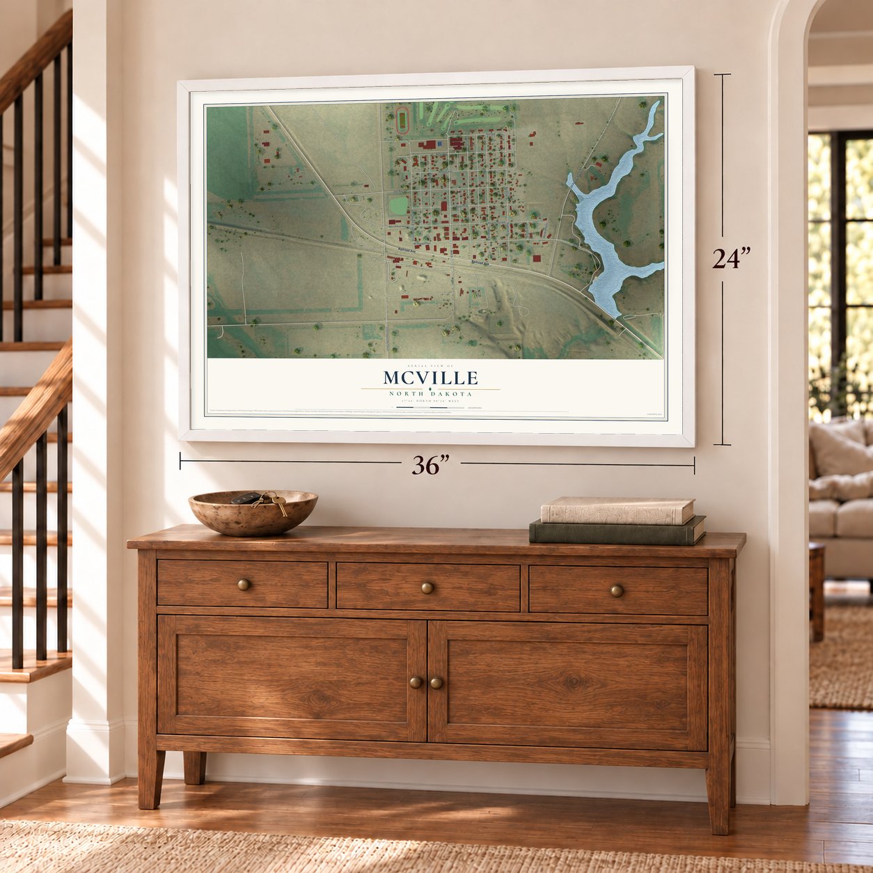 McVille, North Dakota map, 24 x 36 inch print in a white frame above a dresser by a staircase