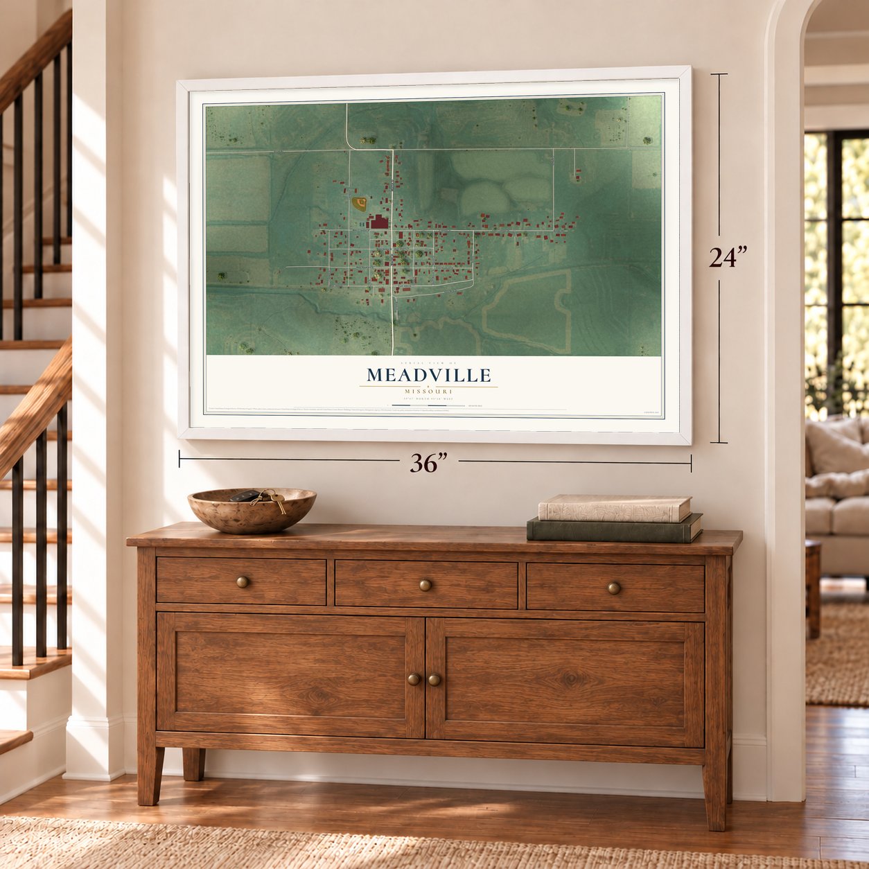 Meadville, Missouri map, 24 x 36 inch print in a white frame above a dresser by a staircase