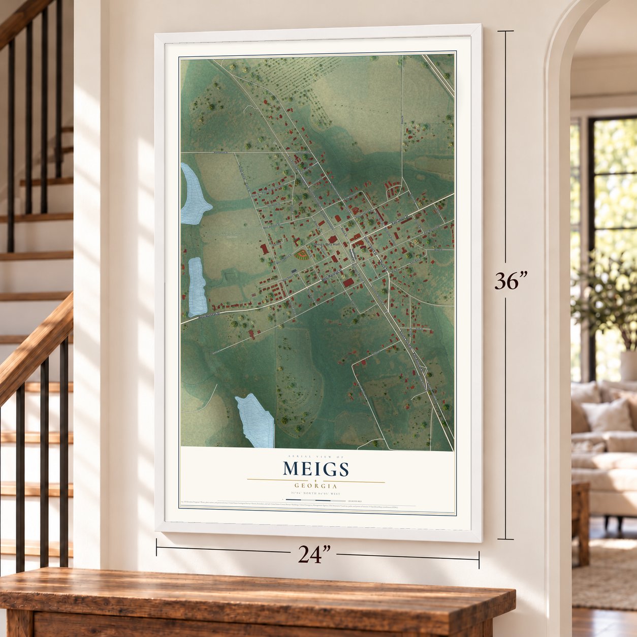 Meigs, Georgia map, 24 x 36 inch print in a white frame by a staircase