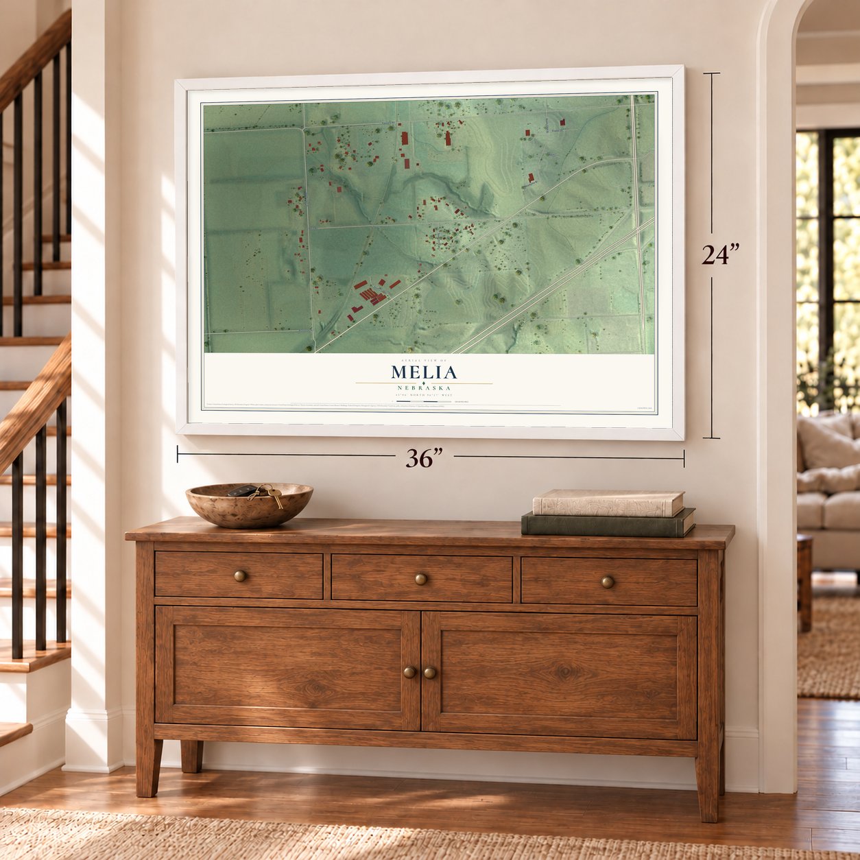 Melia, Nebraska map, 24 x 36 inch print in a white frame above a dresser by a staircase