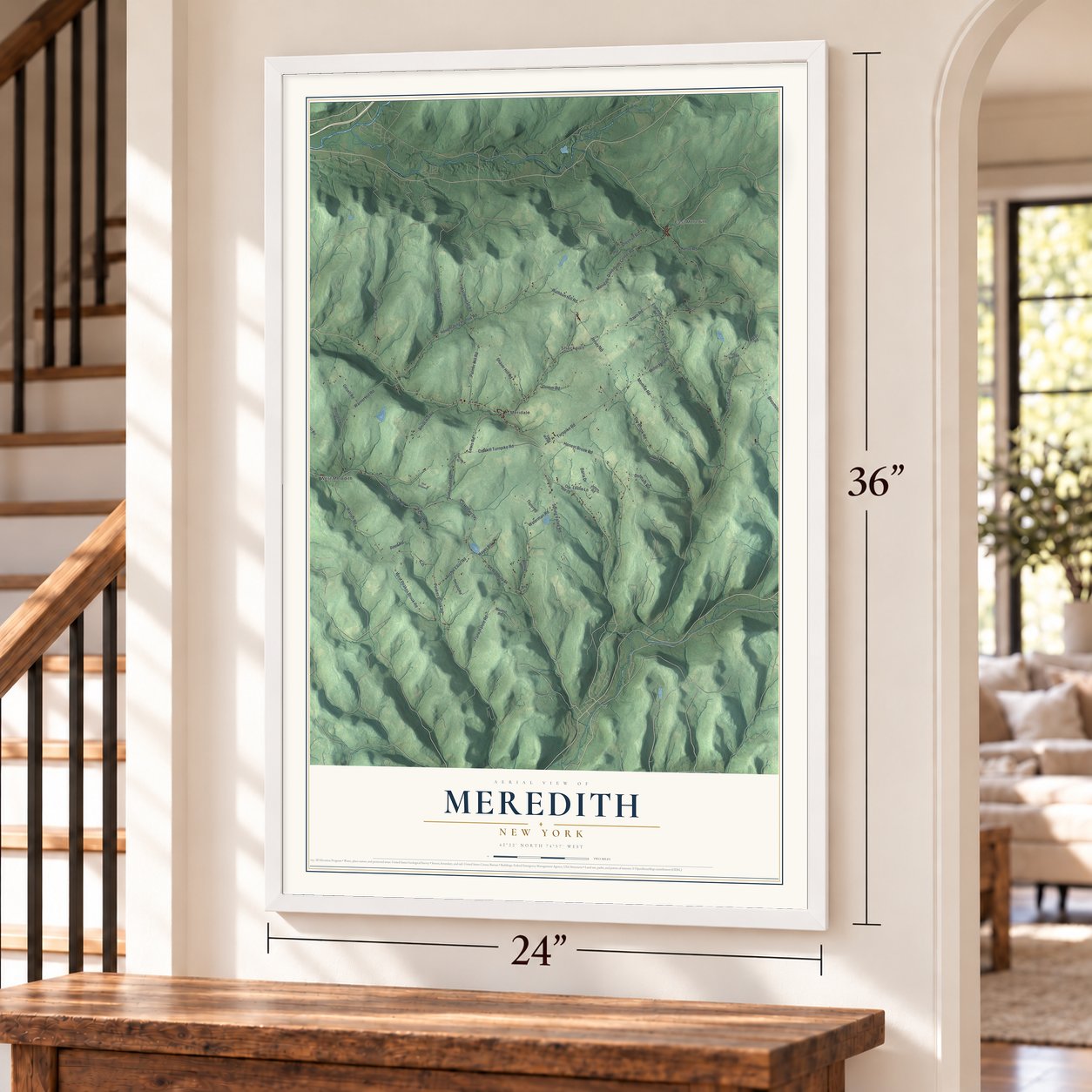 Meredith, New York map, 24 x 36 inch print in a white frame by a staircase
