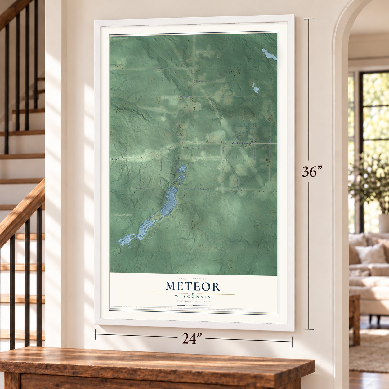 Meteor, Wisconsin map, 24 x 36 inch print in a white frame by a staircase