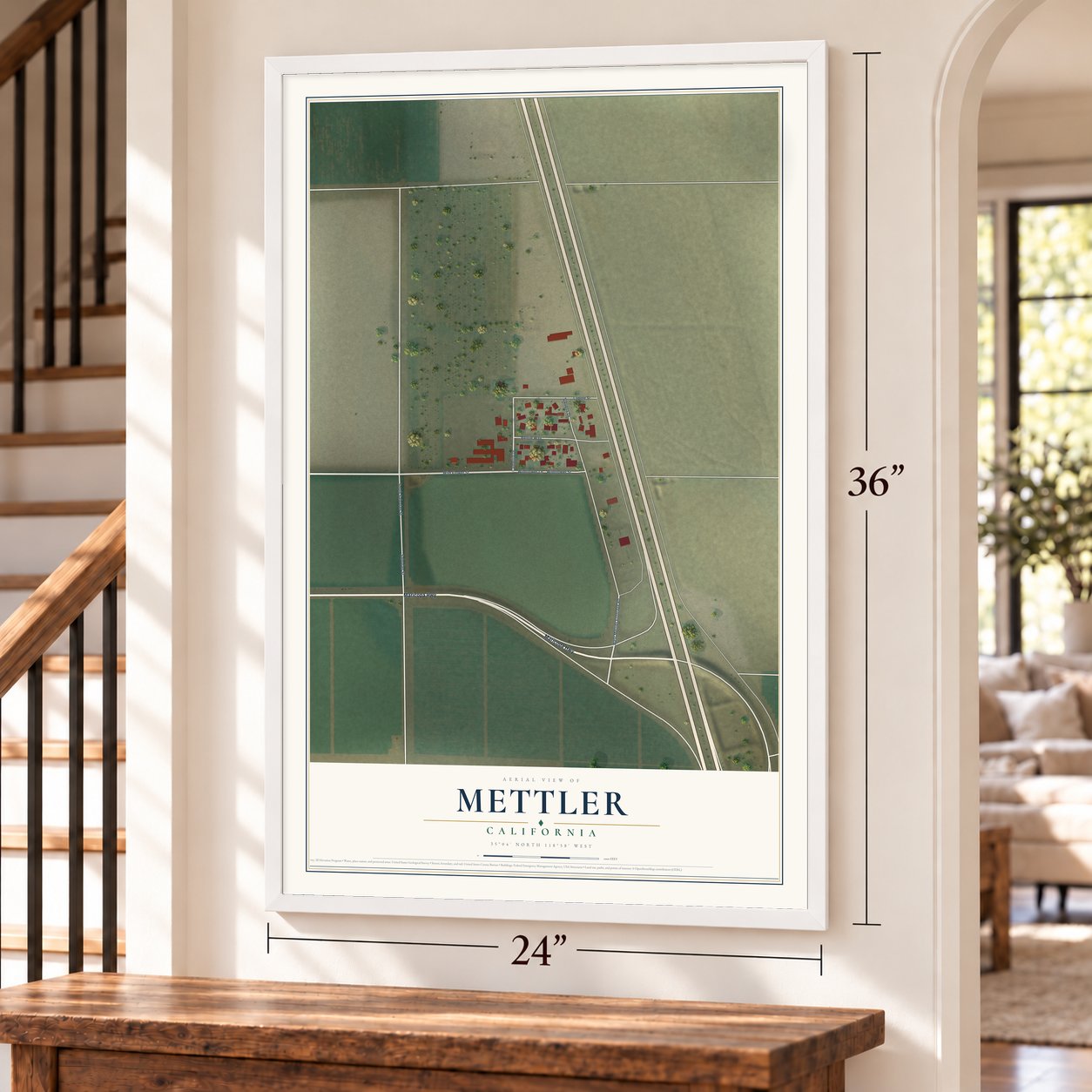 Mettler, California map, 24 x 36 inch print in a white frame by a staircase