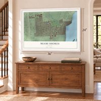 Miami Shores, Florida map, 24 x 36 inch print in a white frame above a dresser by a staircase