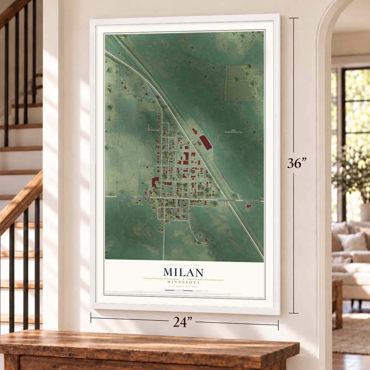 Milan, Minnesota map, 24 x 36 inch print in a white frame by a staircase