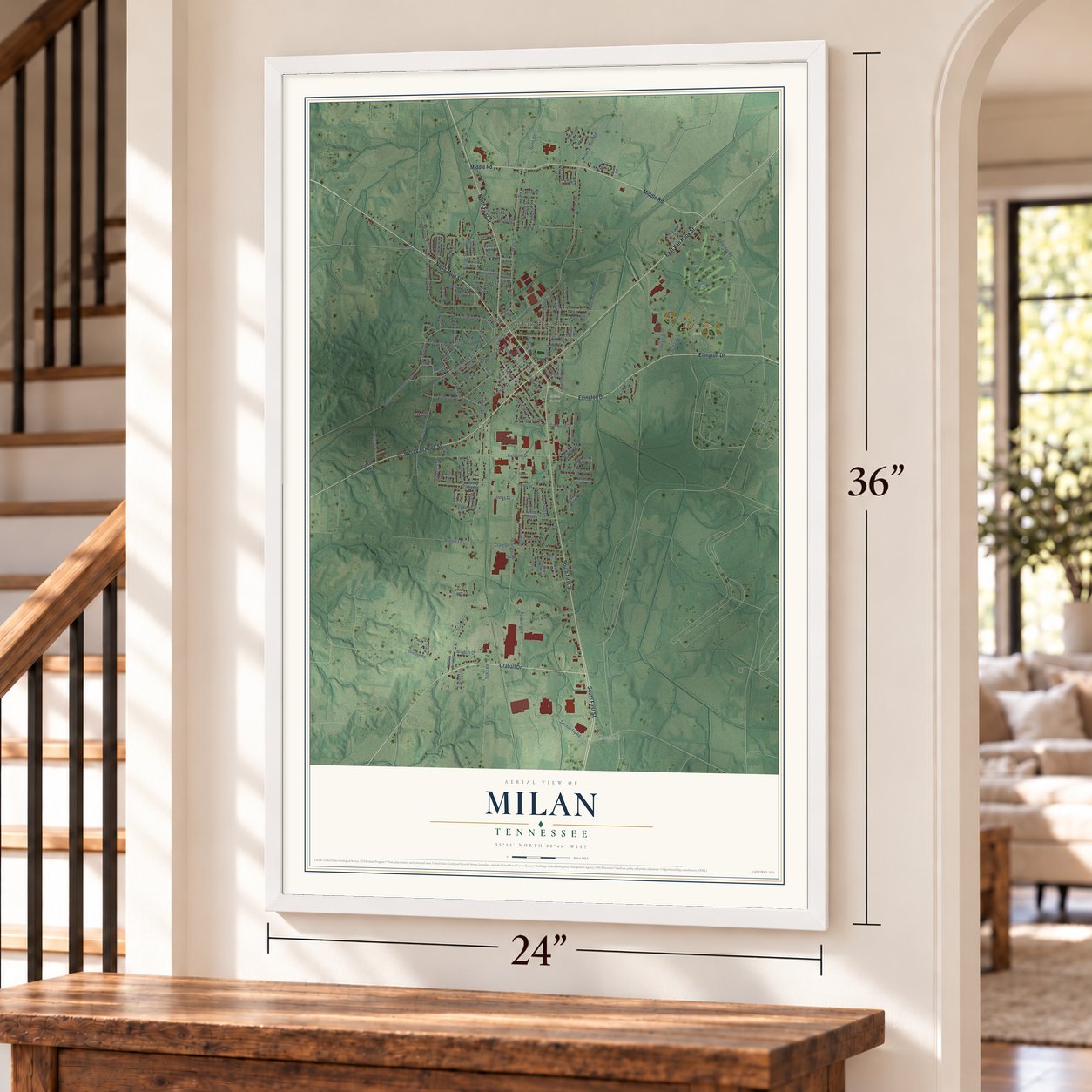 Milan, Tennessee map, 24 x 36 inch print in a white frame by a staircase