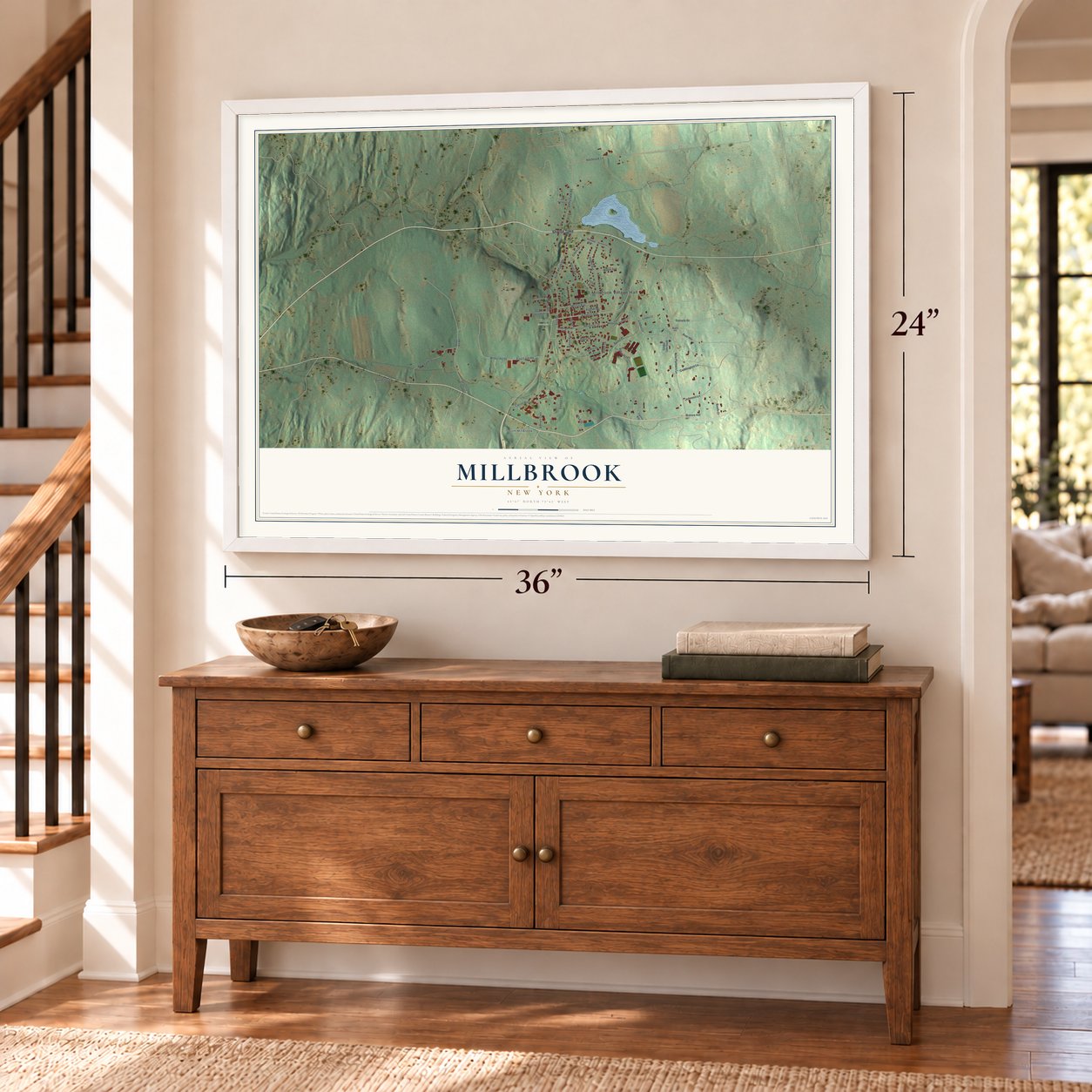 Millbrook, New York map, 24 x 36 inch print in a white frame above a dresser by a staircase