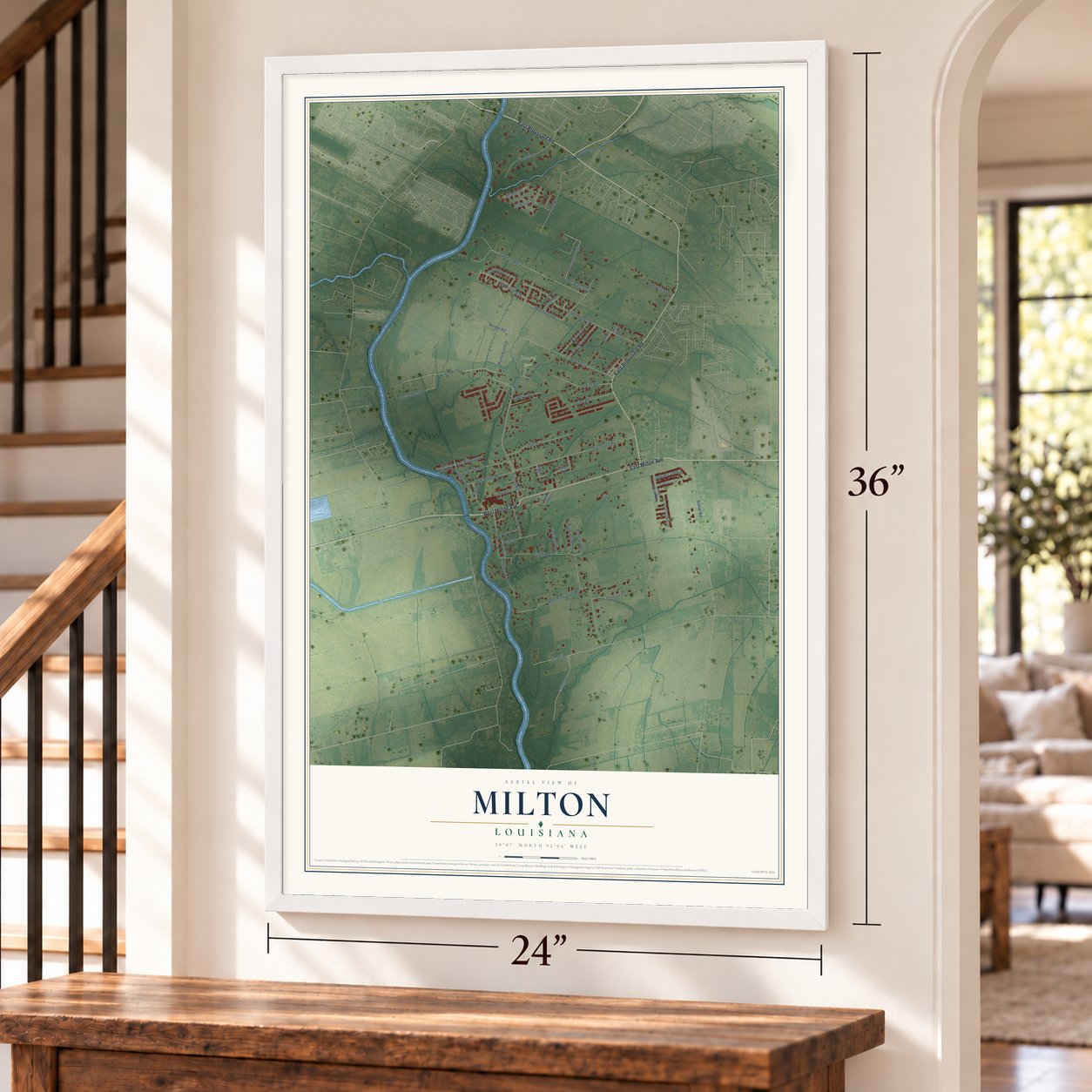 Milton, Louisiana map, 24 x 36 inch print in a white frame by a staircase