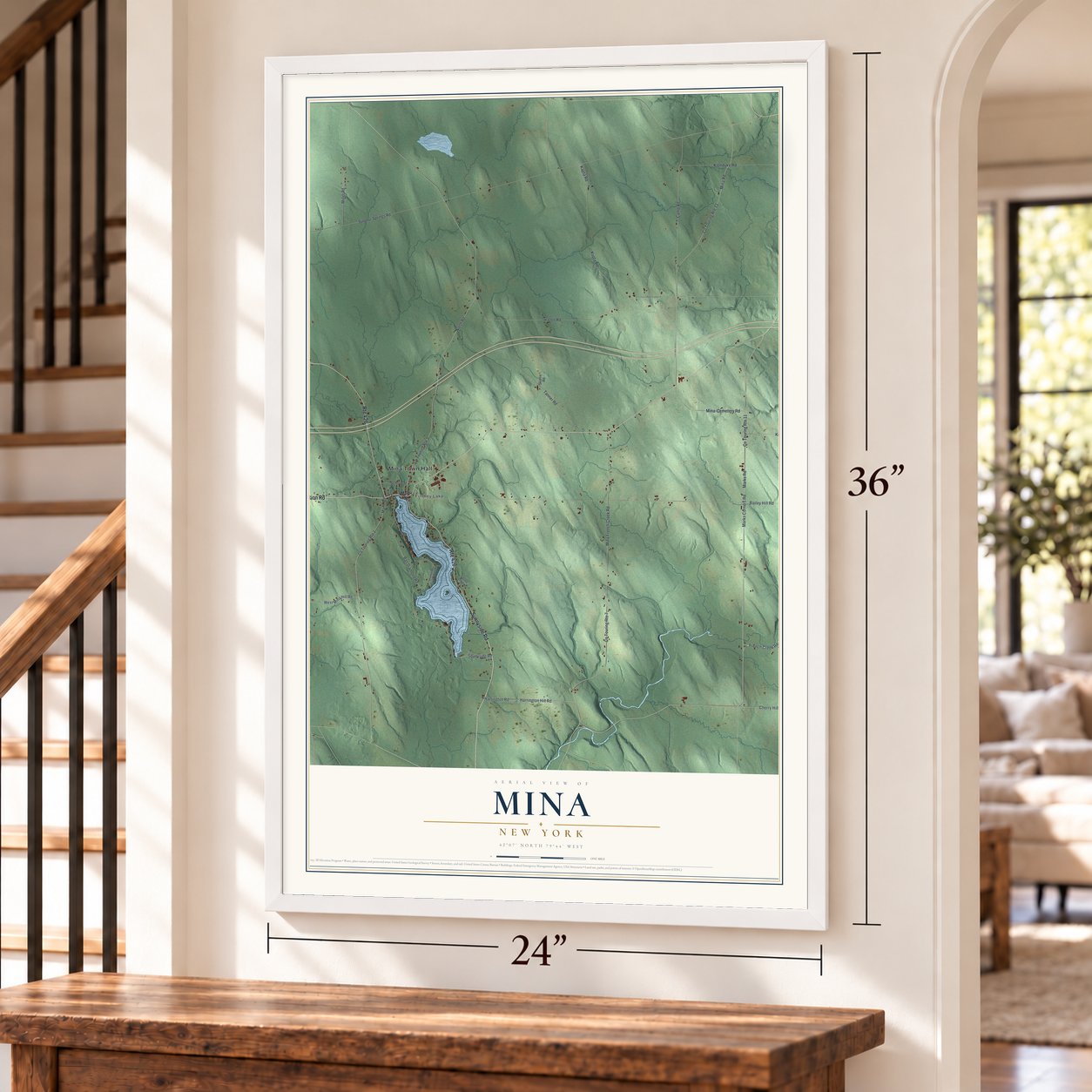 Mina, New York map, 24 x 36 inch print in a white frame by a staircase