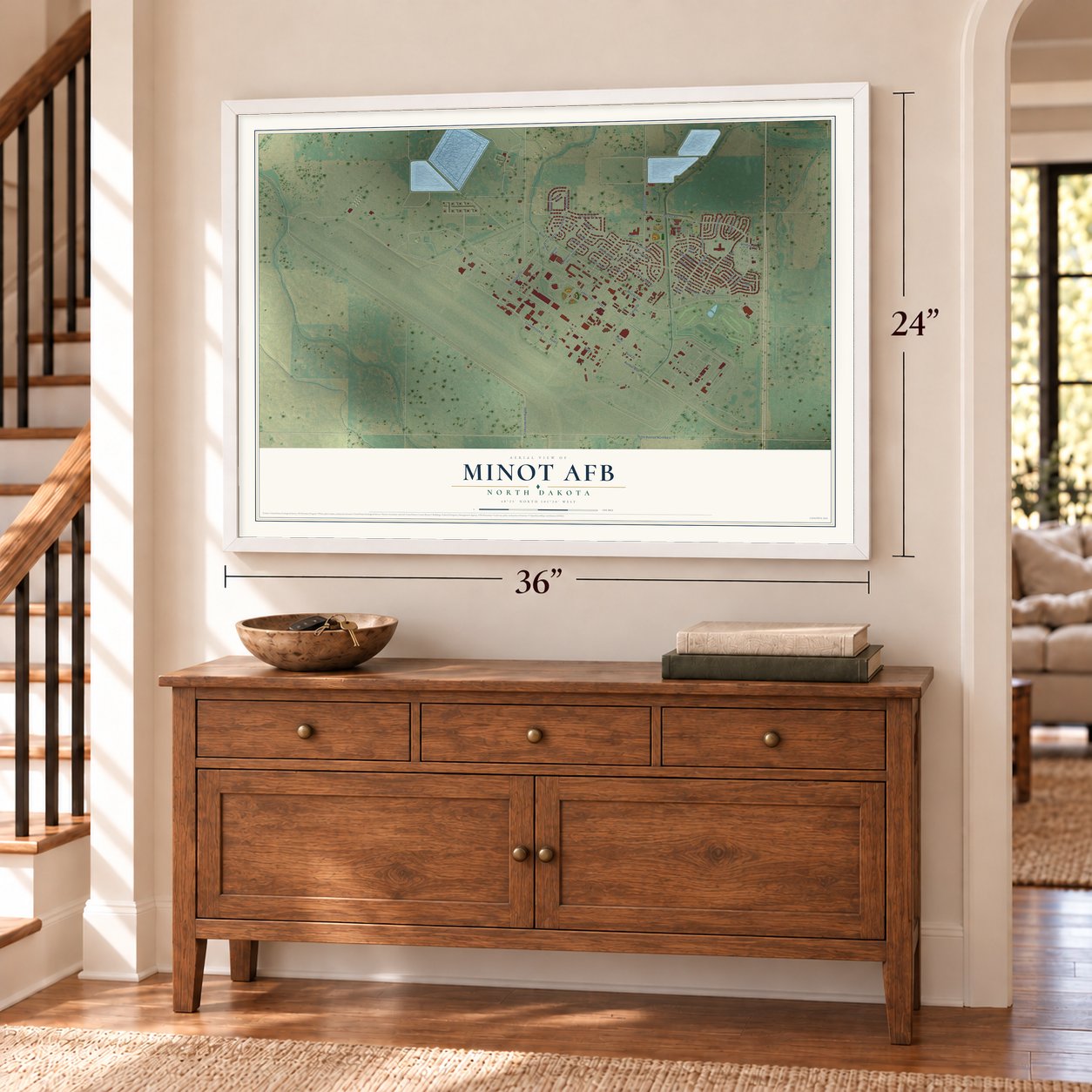 Minot AFB, North Dakota map, 24 x 36 inch print in a white frame above a dresser by a staircase