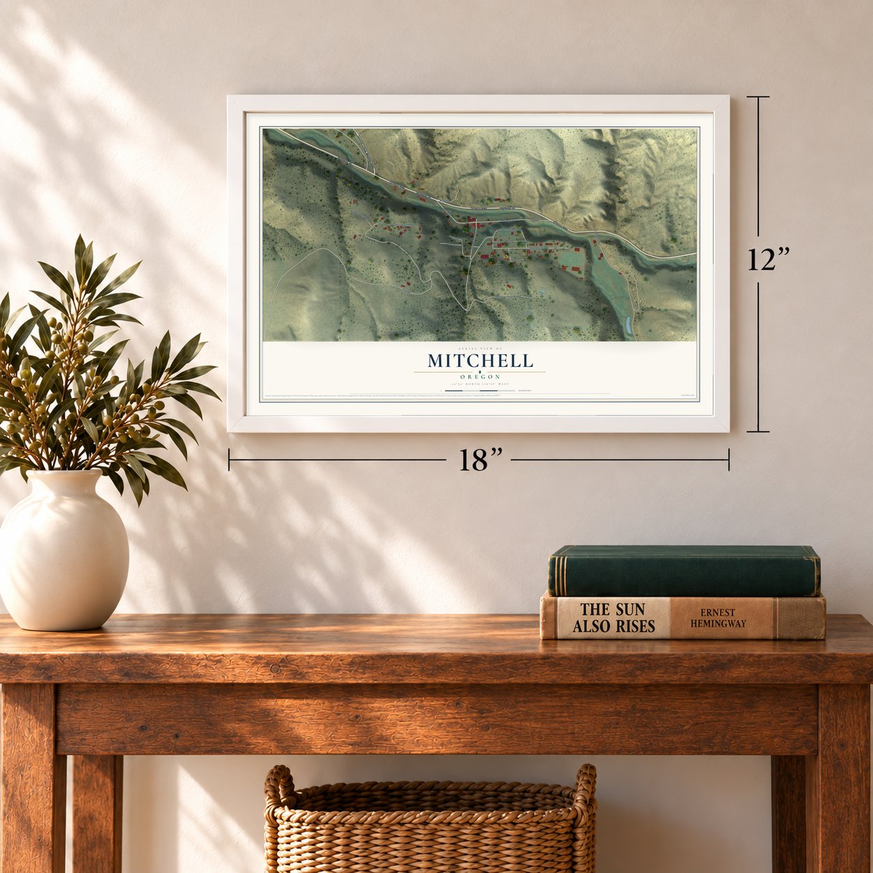 Mitchell, Oregon map, 12 x 18 inch print in a white frame in an entryway