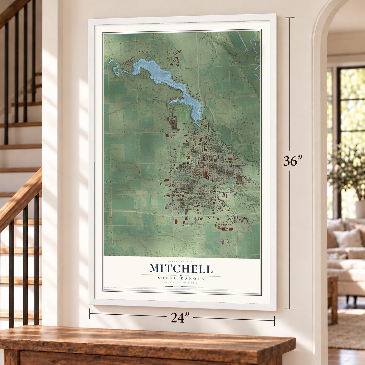 Mitchell, South Dakota map, 24 x 36 inch print in a white frame by a staircase