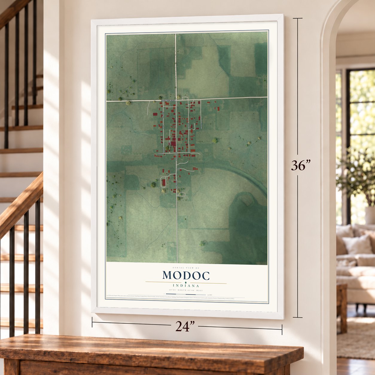 Modoc, Indiana map, 24 x 36 inch print in a white frame by a staircase