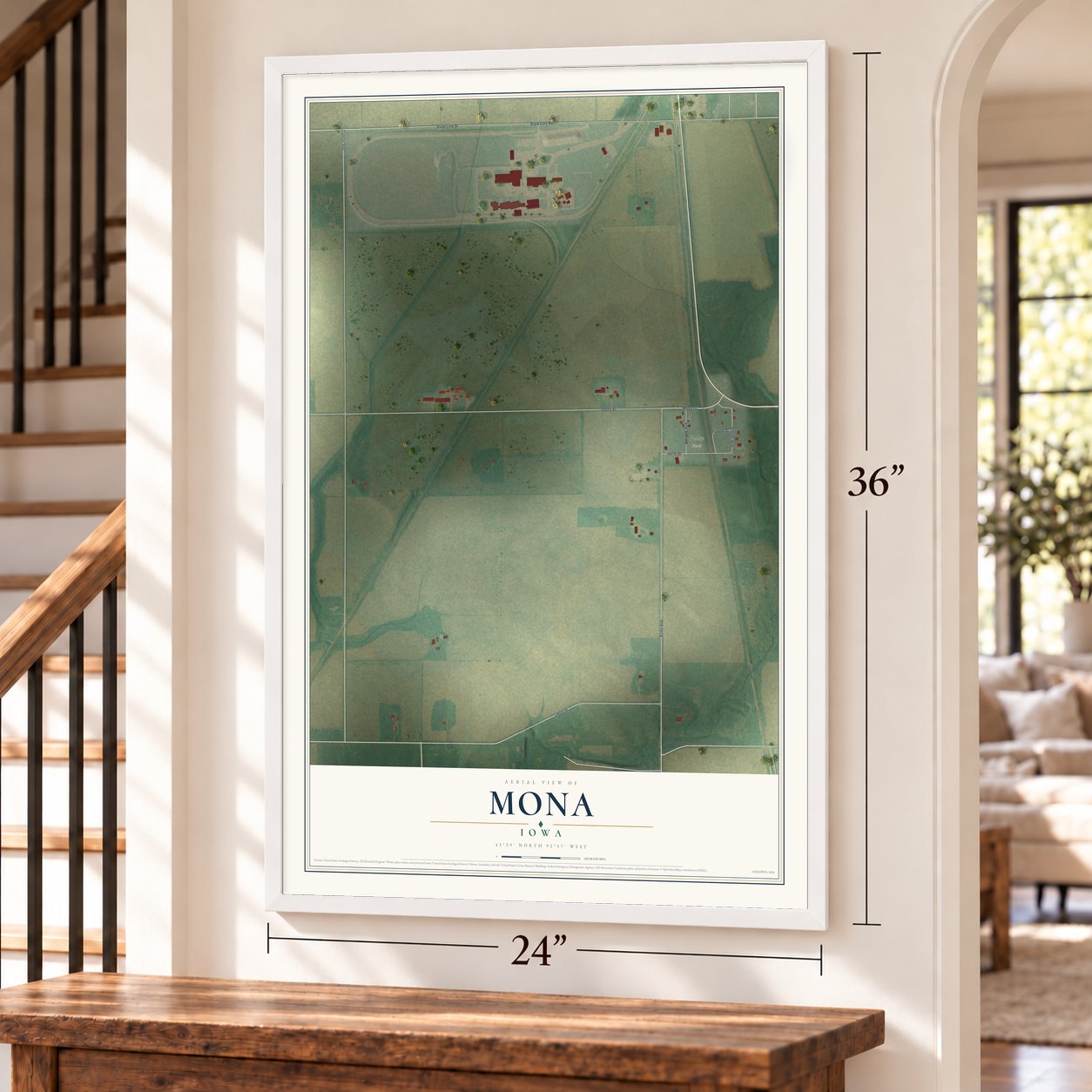 Mona, Iowa map, 24 x 36 inch print in a white frame by a staircase