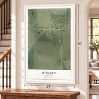 Monroe, Arkansas map, 24 x 36 inch print in a white frame by a staircase