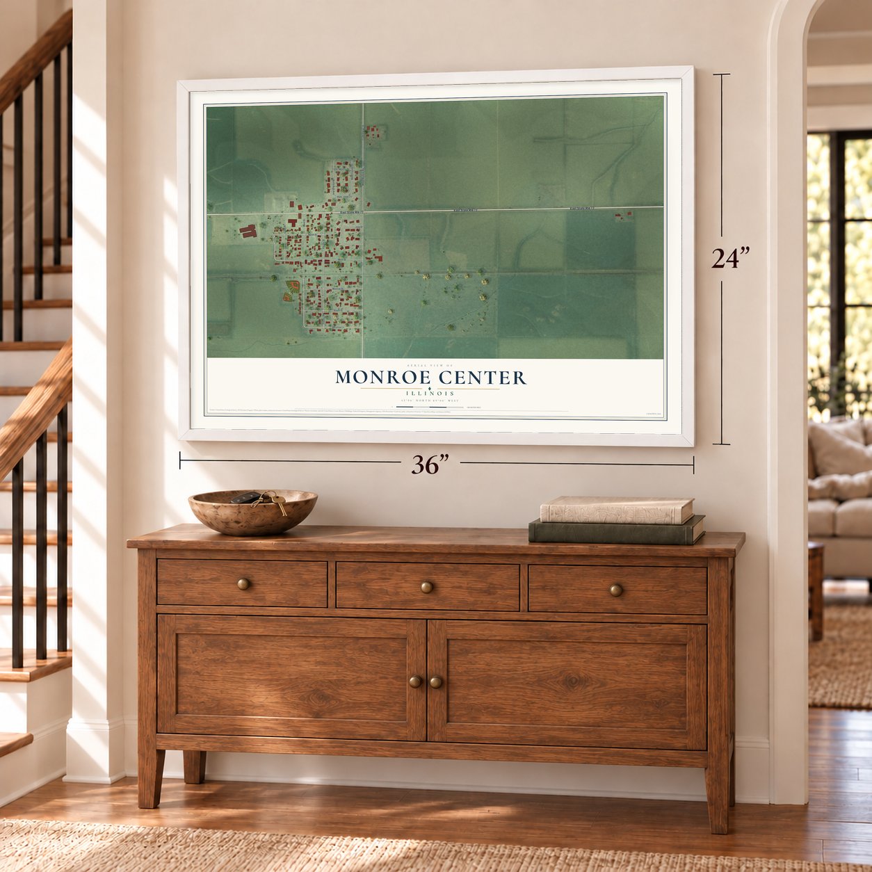 Monroe Center, Illinois map, 24 x 36 inch print in a white frame above a dresser by a staircase