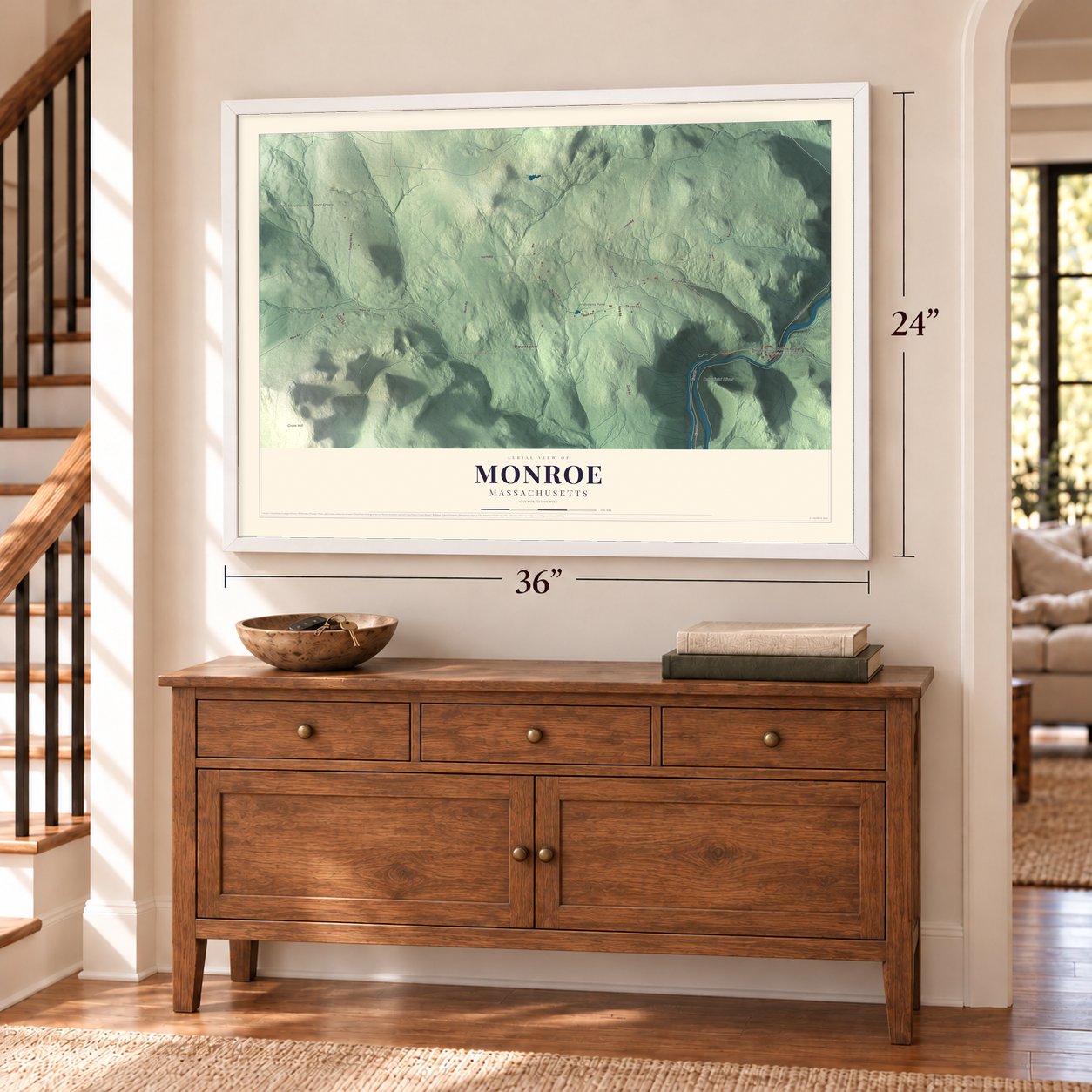 Monroe, Massachusetts map, 24 x 36 inch print in a white frame above a dresser by a staircase