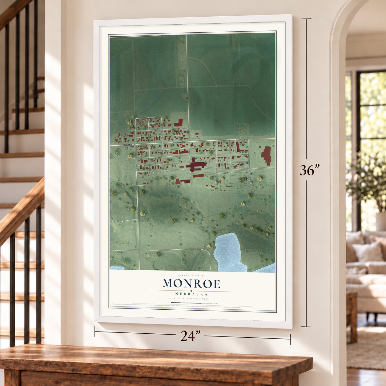 Monroe, Nebraska map, 24 x 36 inch print in a white frame by a staircase