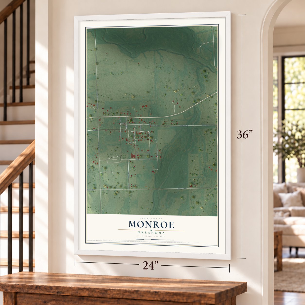 Monroe, Oklahoma map, 24 x 36 inch print in a white frame by a staircase