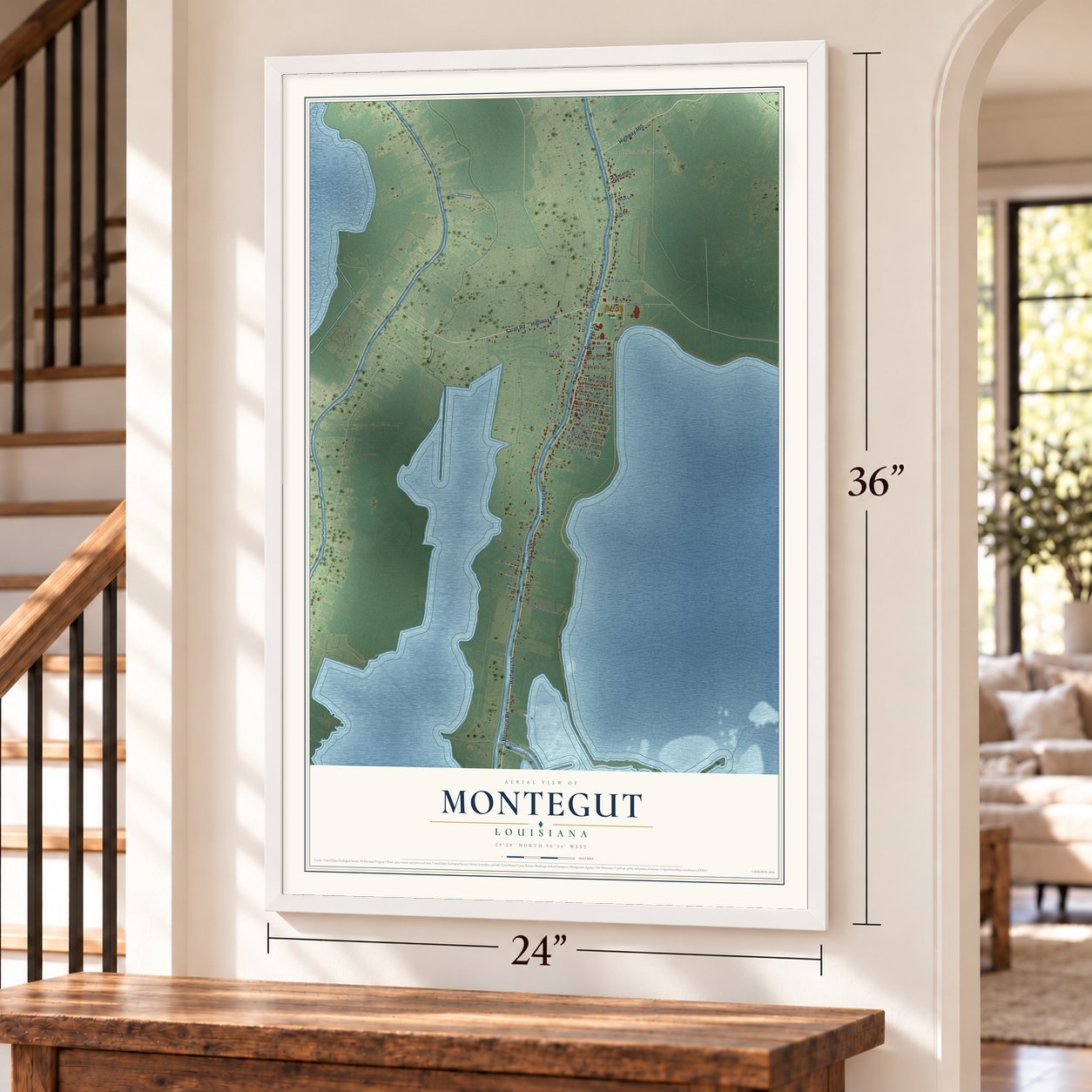 Montegut, Louisiana map, 24 x 36 inch print in a white frame by a staircase