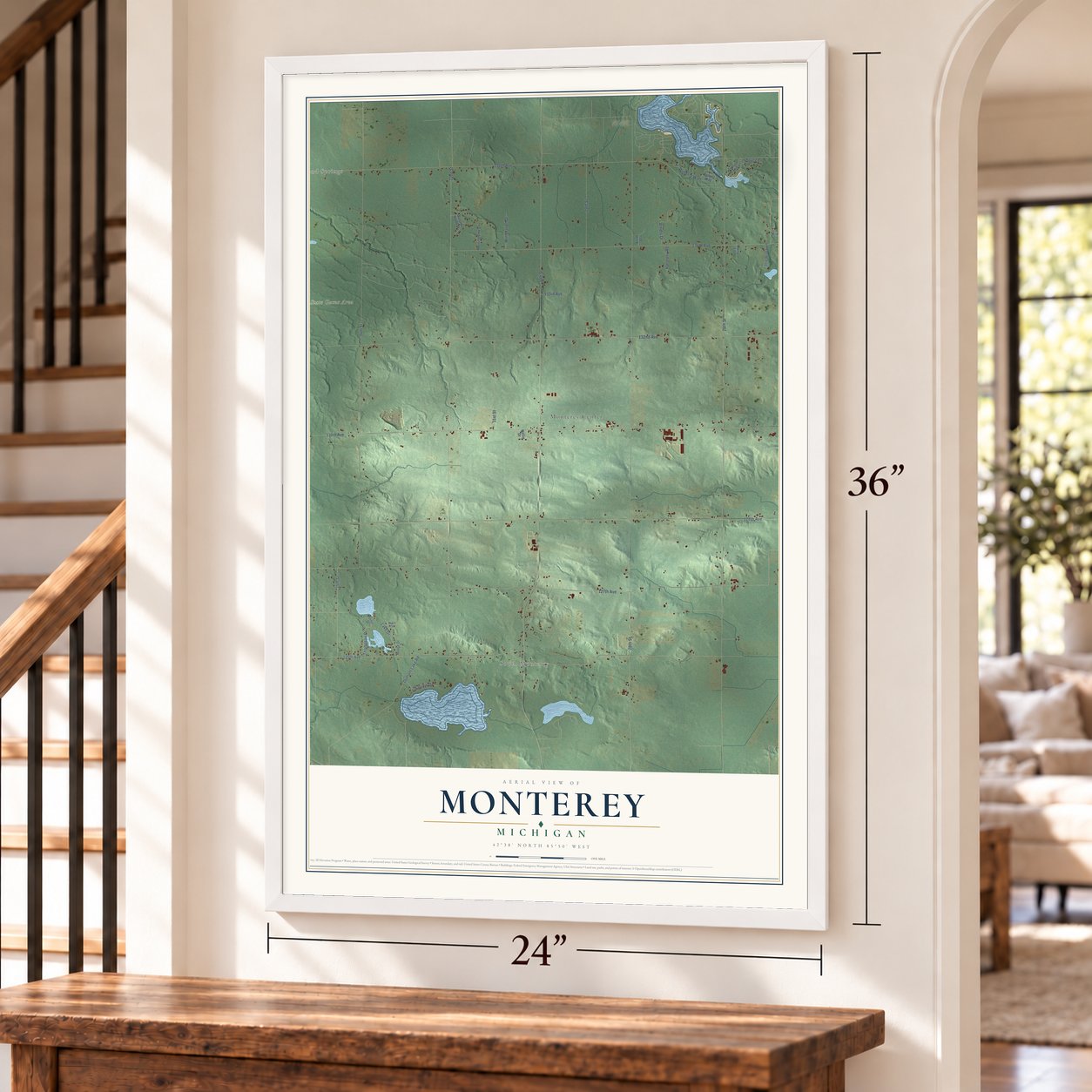 Monterey, Michigan map, 24 x 36 inch print in a white frame by a staircase