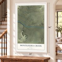 Montezuma Creek, Utah map, 24 x 36 inch print in a white frame by a staircase
