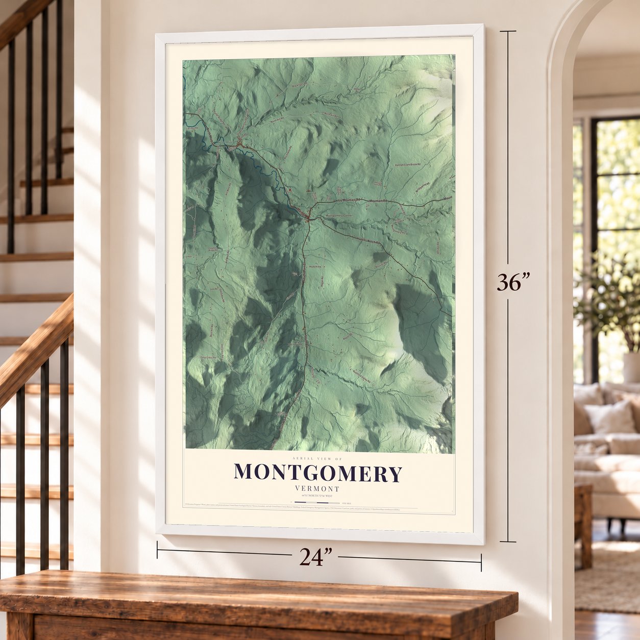 Montgomery, Vermont map, 24 x 36 inch print in a white frame by a staircase
