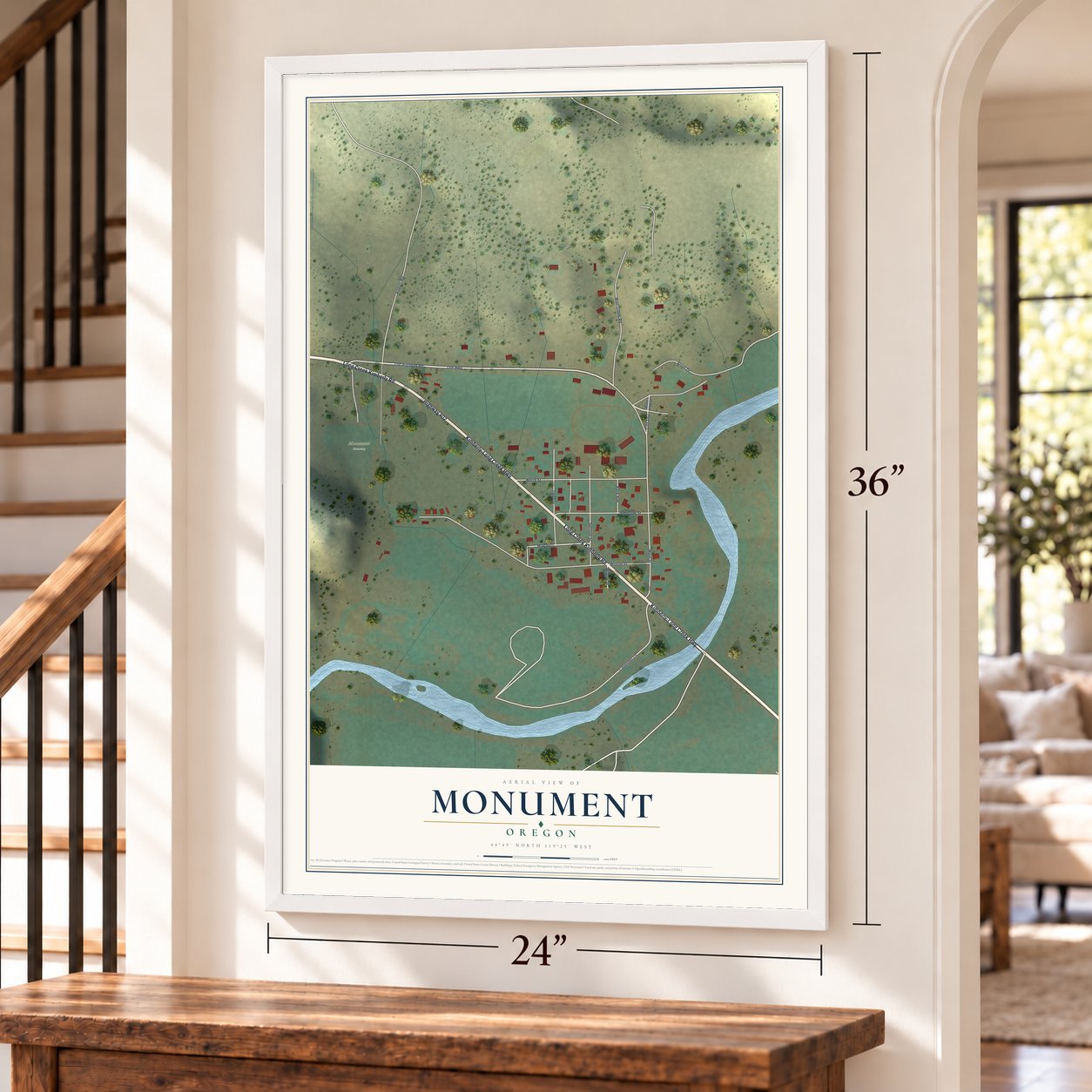 Monument, Oregon map, 24 x 36 inch print in a white frame by a staircase