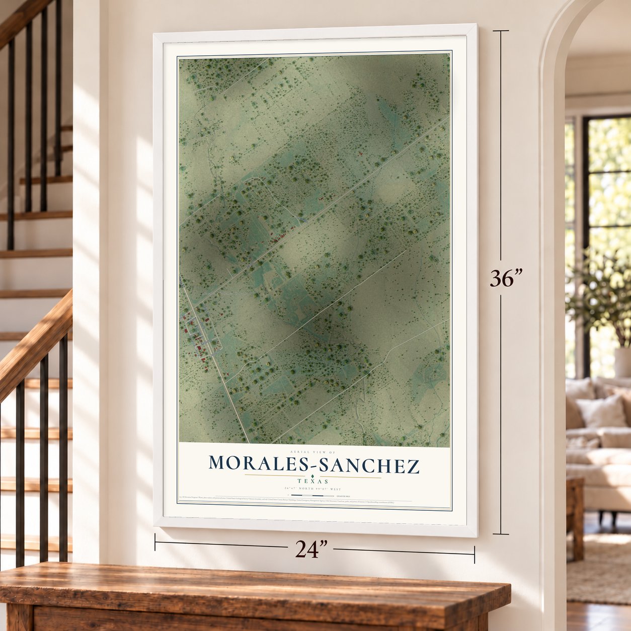 Morales-Sanchez, Texas map, 24 x 36 inch print in a white frame by a staircase