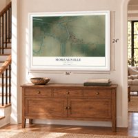 Moreauville, Louisiana map, 24 x 36 inch print in a white frame above a dresser by a staircase