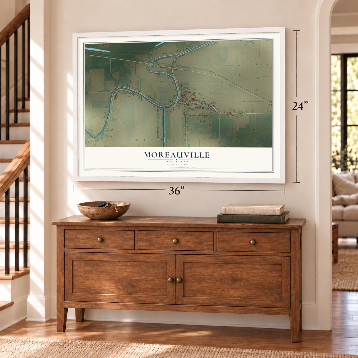 Moreauville, Louisiana map, 24 x 36 inch print in a white frame above a dresser by a staircase