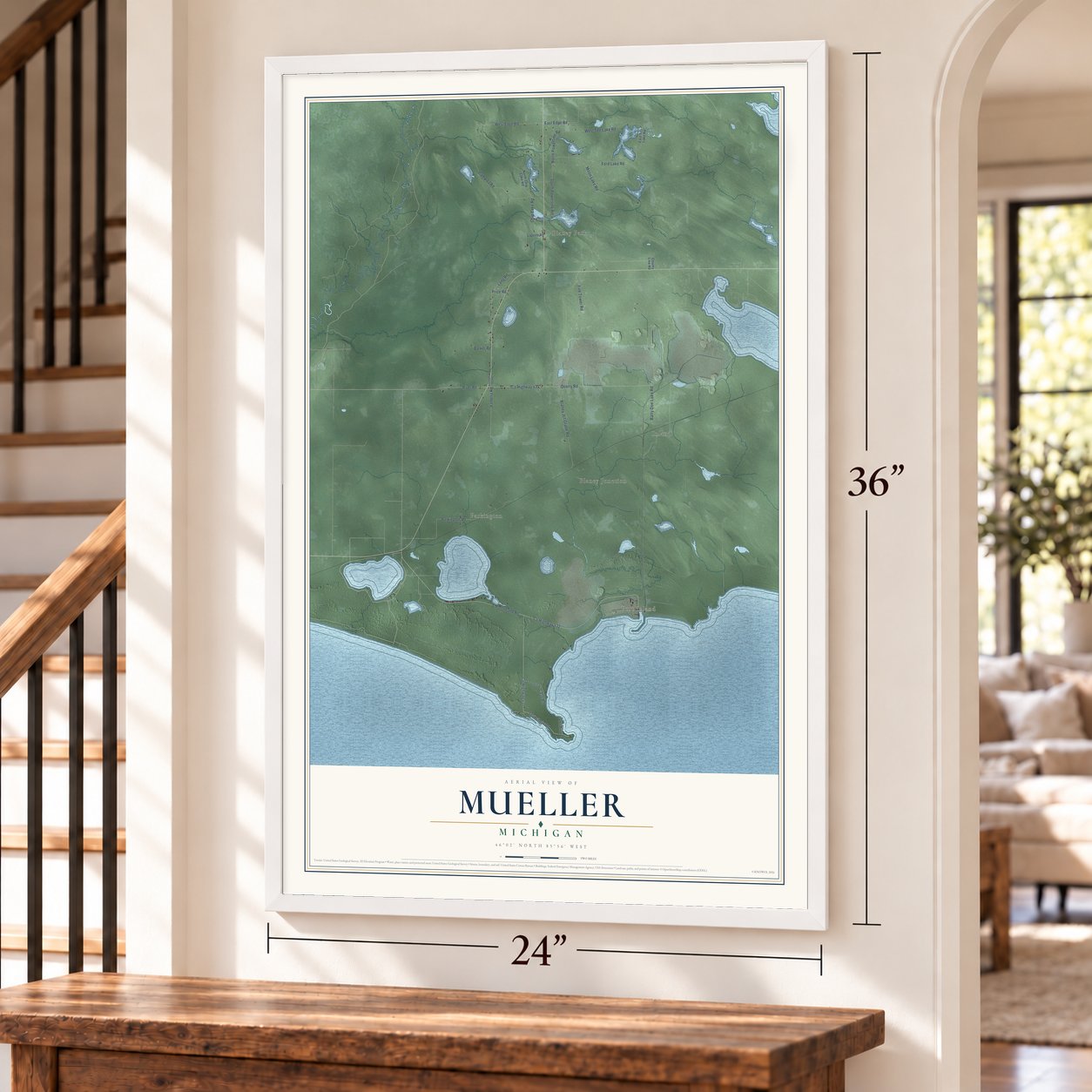 Mueller, Michigan map, 24 x 36 inch print in a white frame by a staircase