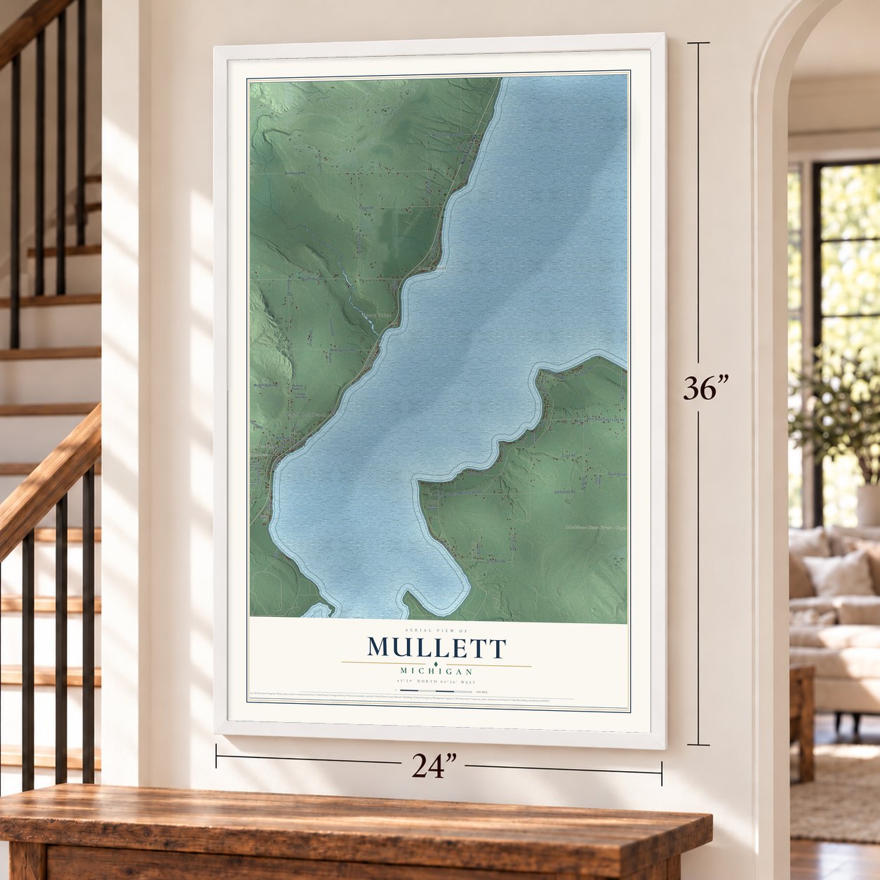 Mullett, Michigan map, 24 x 36 inch print in a white frame by a staircase