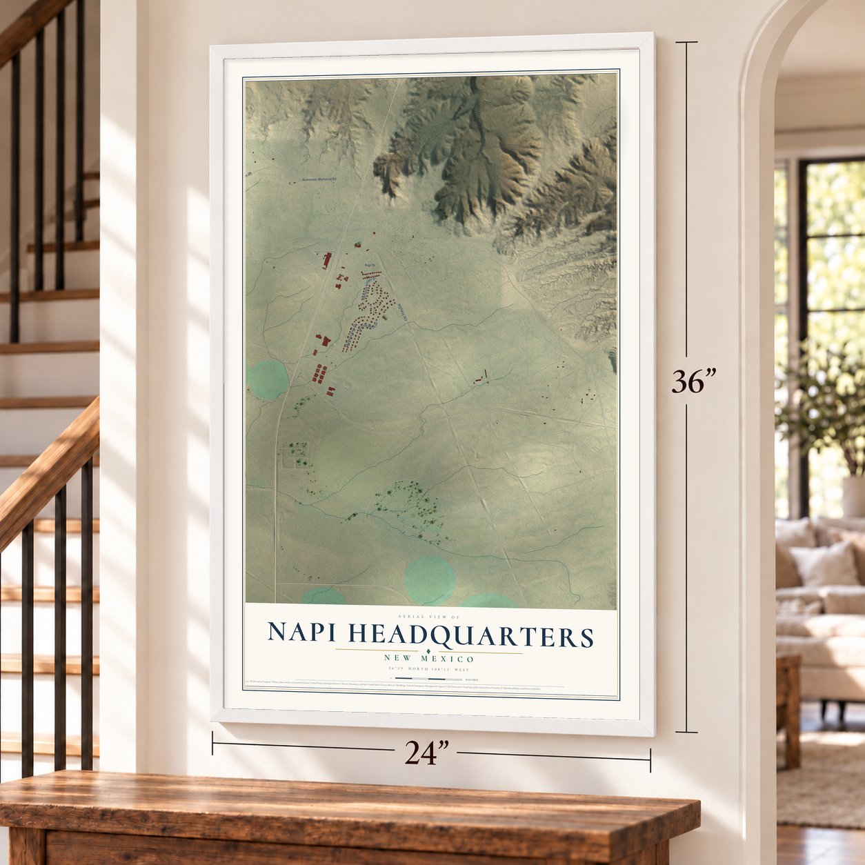 Napi Headquarters, New Mexico map, 24 x 36 inch print in a white frame by a staircase