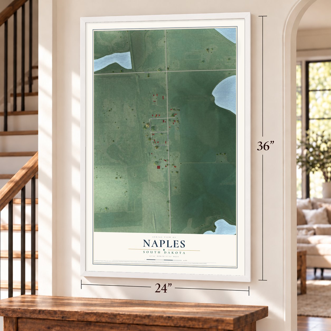 Naples, South Dakota map, 24 x 36 inch print in a white frame by a staircase