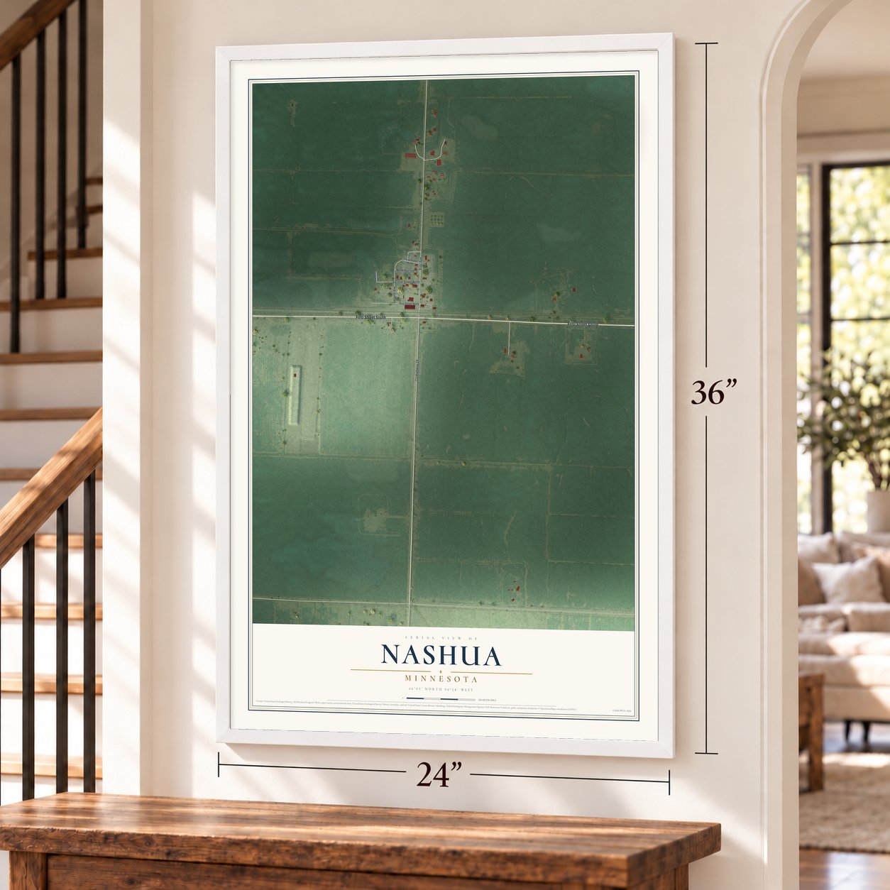 Nashua, Minnesota map, 24 x 36 inch print in a white frame by a staircase