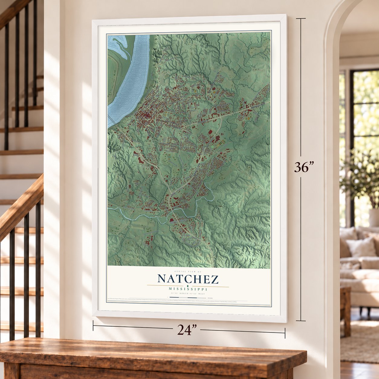 Natchez, Mississippi map, 24 x 36 inch print in a white frame by a staircase