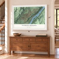 Natrona Heights, Pennsylvania map, 24 x 36 inch print in a white frame above a dresser by a staircase