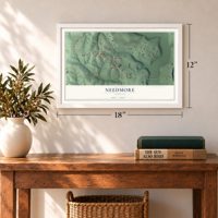 Needmore, Indiana map, 12 x 18 inch print in a white frame in an entryway