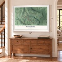 Needmore, Indiana map, 24 x 36 inch print in a white frame above a dresser by a staircase
