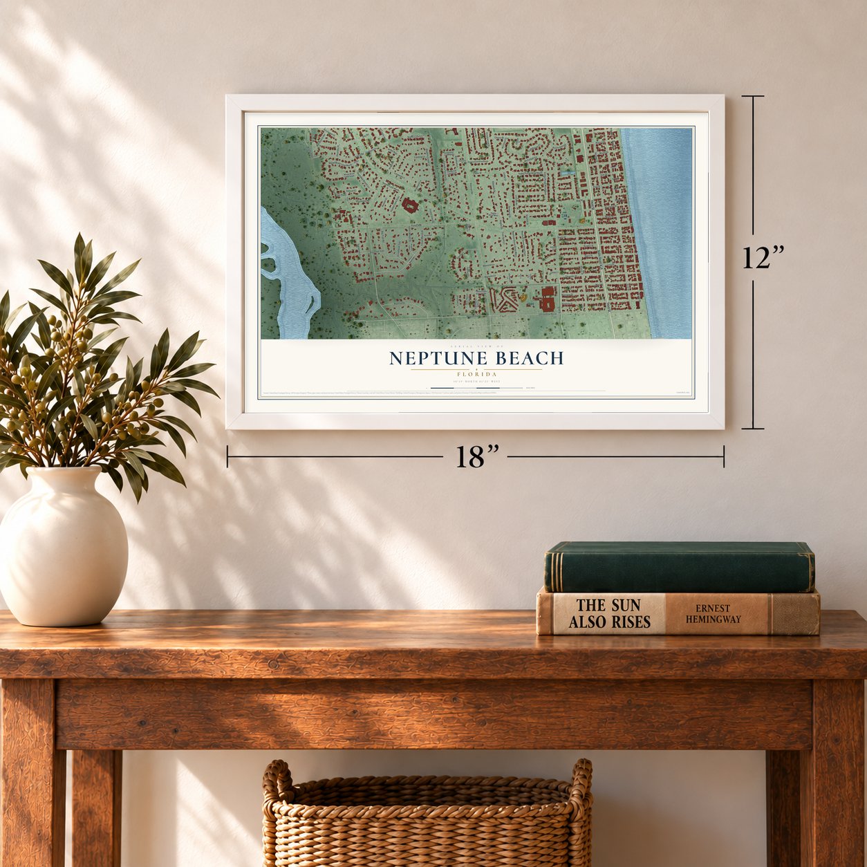 Neptune Beach, Florida map, 12 x 18 inch print in a white frame in an entryway