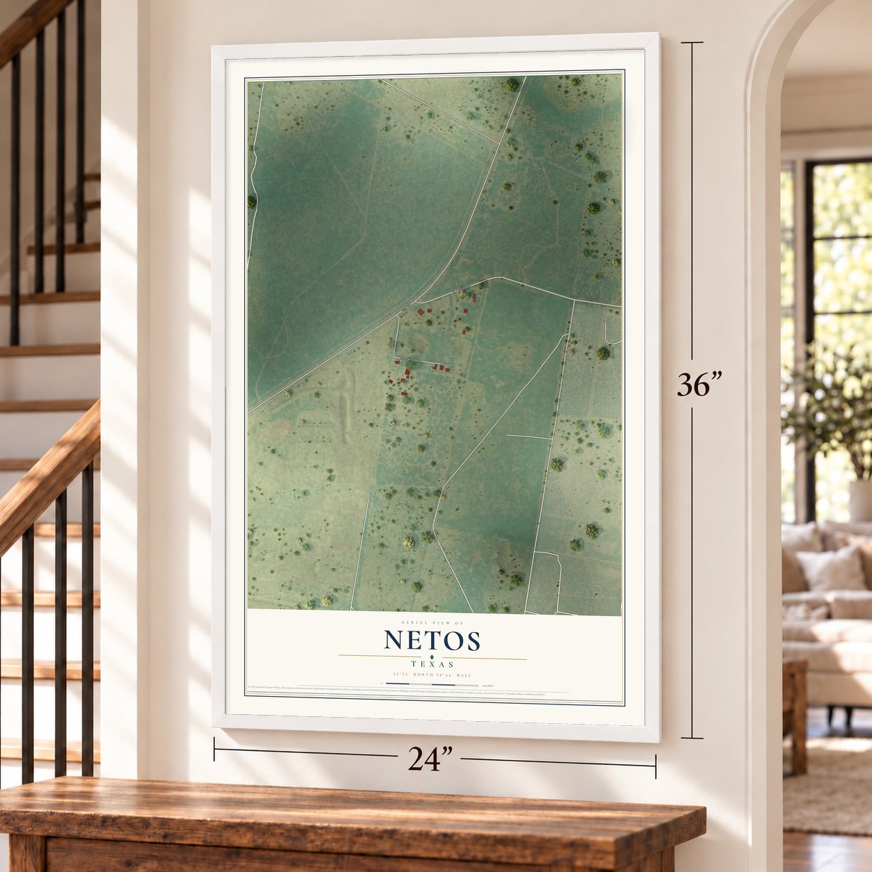 Netos, Texas map, 24 x 36 inch print in a white frame by a staircase
