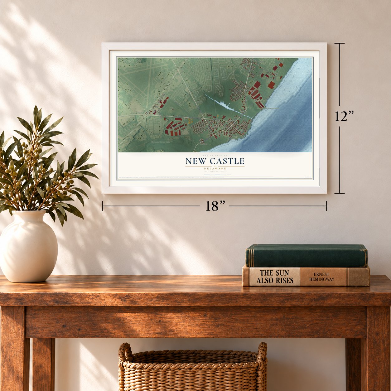 New Castle, Delaware map, 12 x 18 inch print in a white frame in an entryway