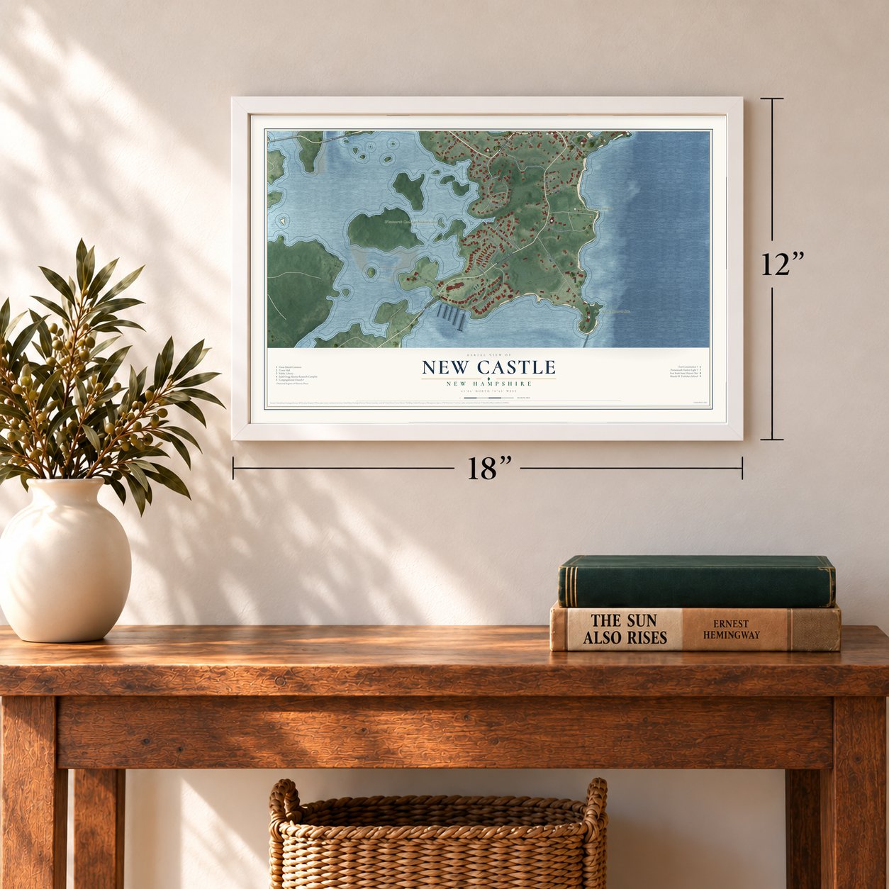 New Castle, New Hampshire map, 12 x 18 inch print in a white frame in an entryway