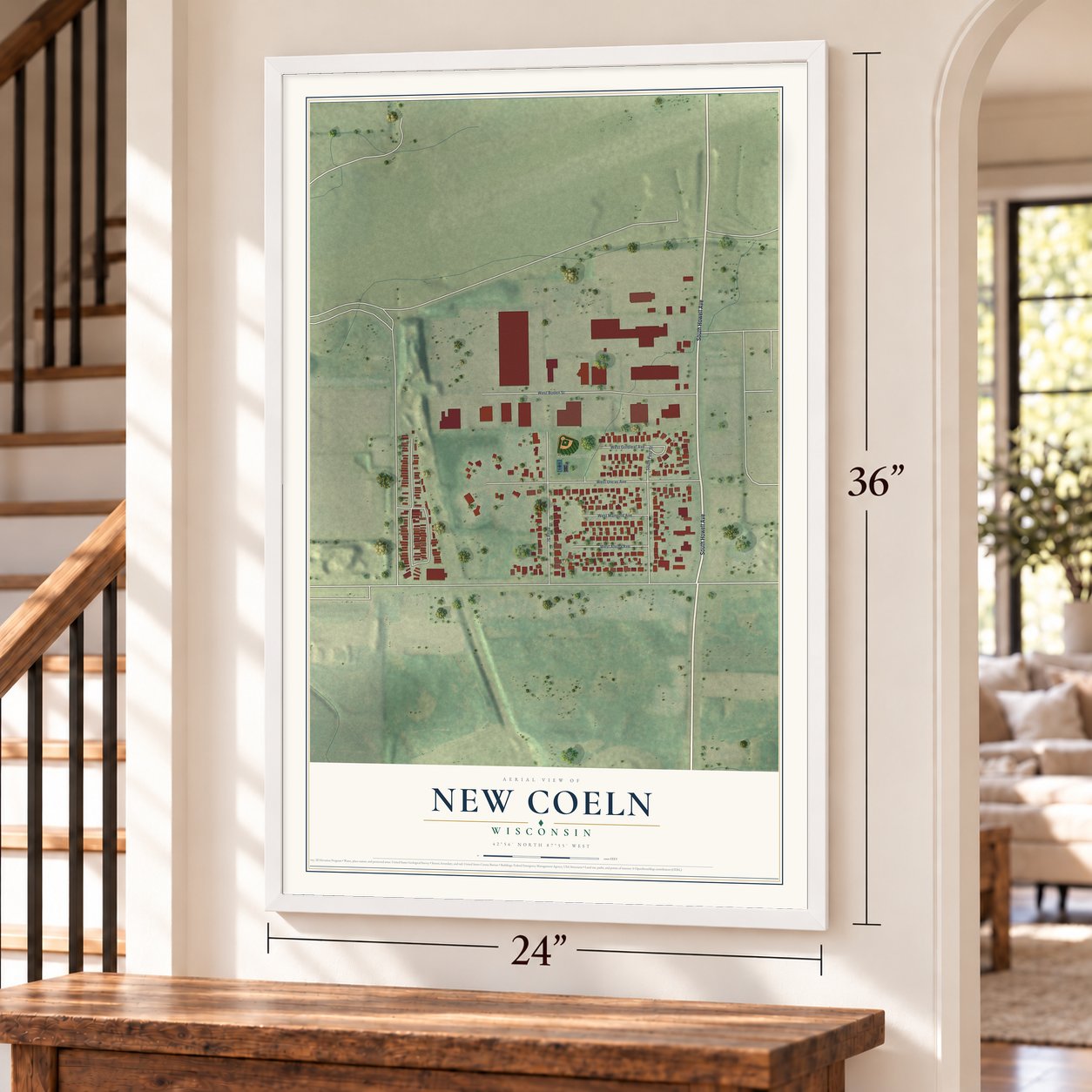 New Coeln, Wisconsin map, 24 x 36 inch print in a white frame by a staircase