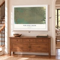 New Pine Creek, California map, 24 x 36 inch print in a white frame above a dresser by a staircase